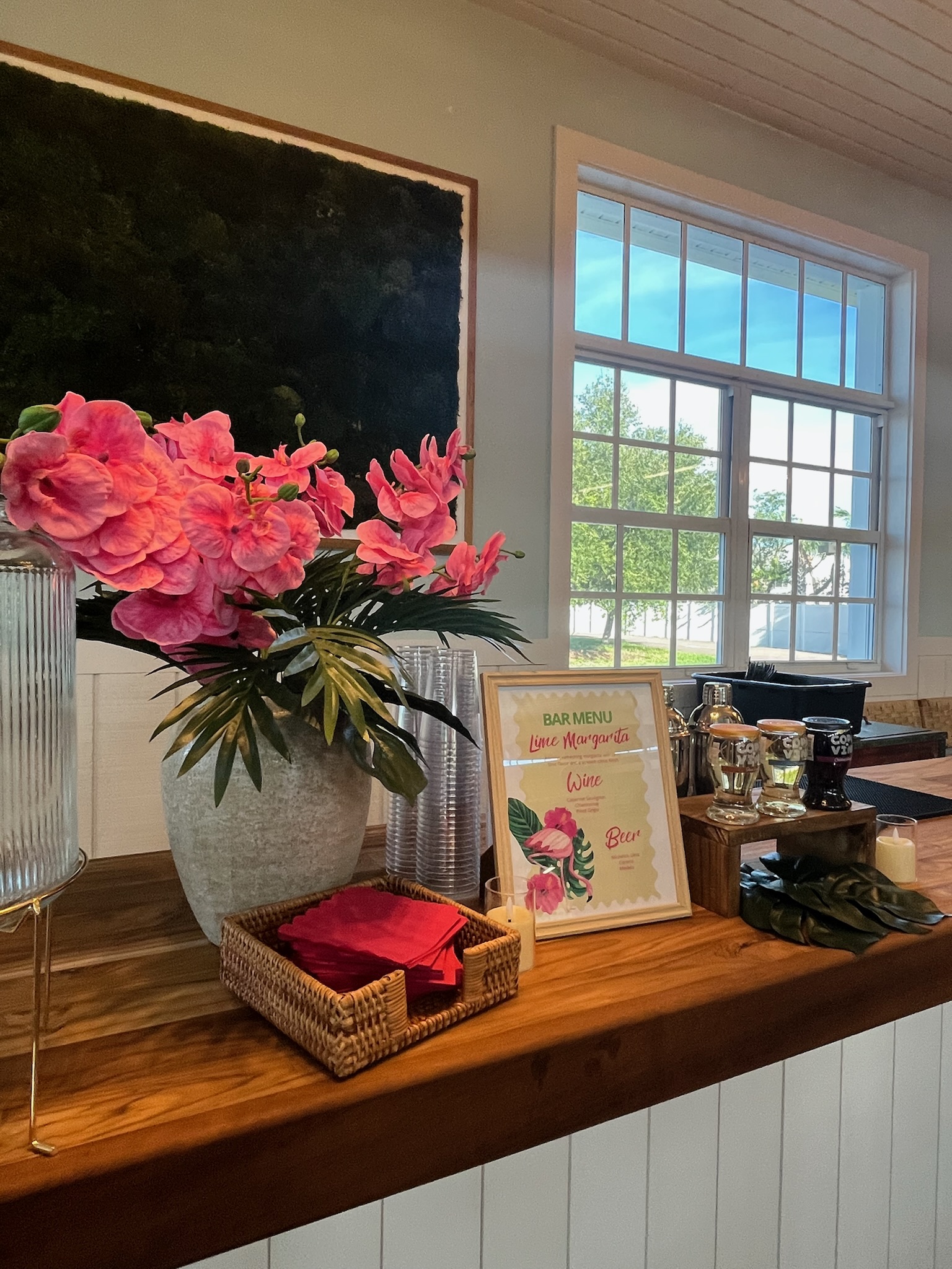 Bar setup with tropical pink orchid display
